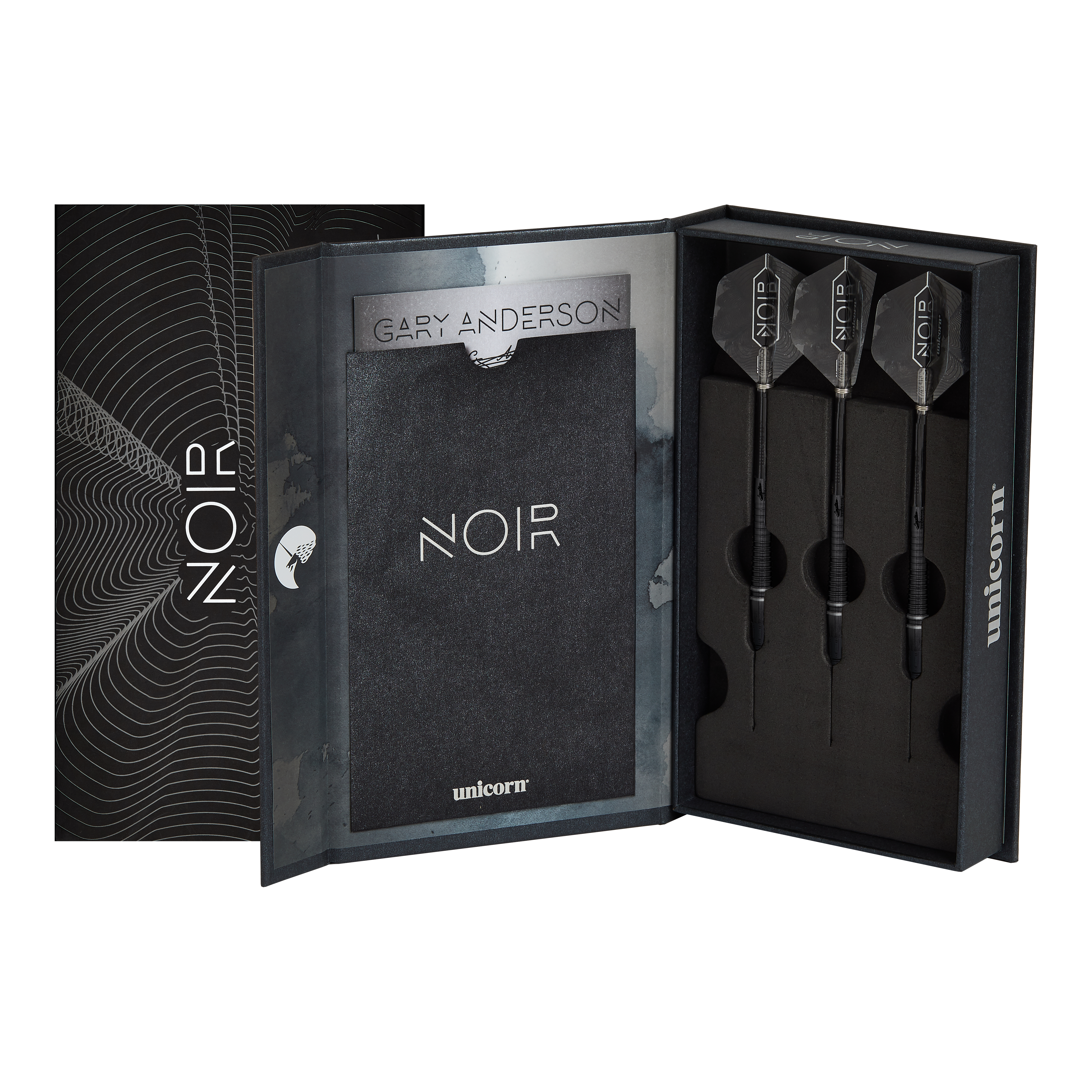 Champion du monde Unicorn Gary Anderson Noir Phase 6 Soft Darts Das Bild zeigt eine elegante schwarze Verpackung mit der Aufschrift "NOIR", in der drei Softdarts ordentlich eingelegt sind. Es handelt sich um das Produkt "Unicorn World Champion Gary Anderson Noir Phase 6 Softdarts".