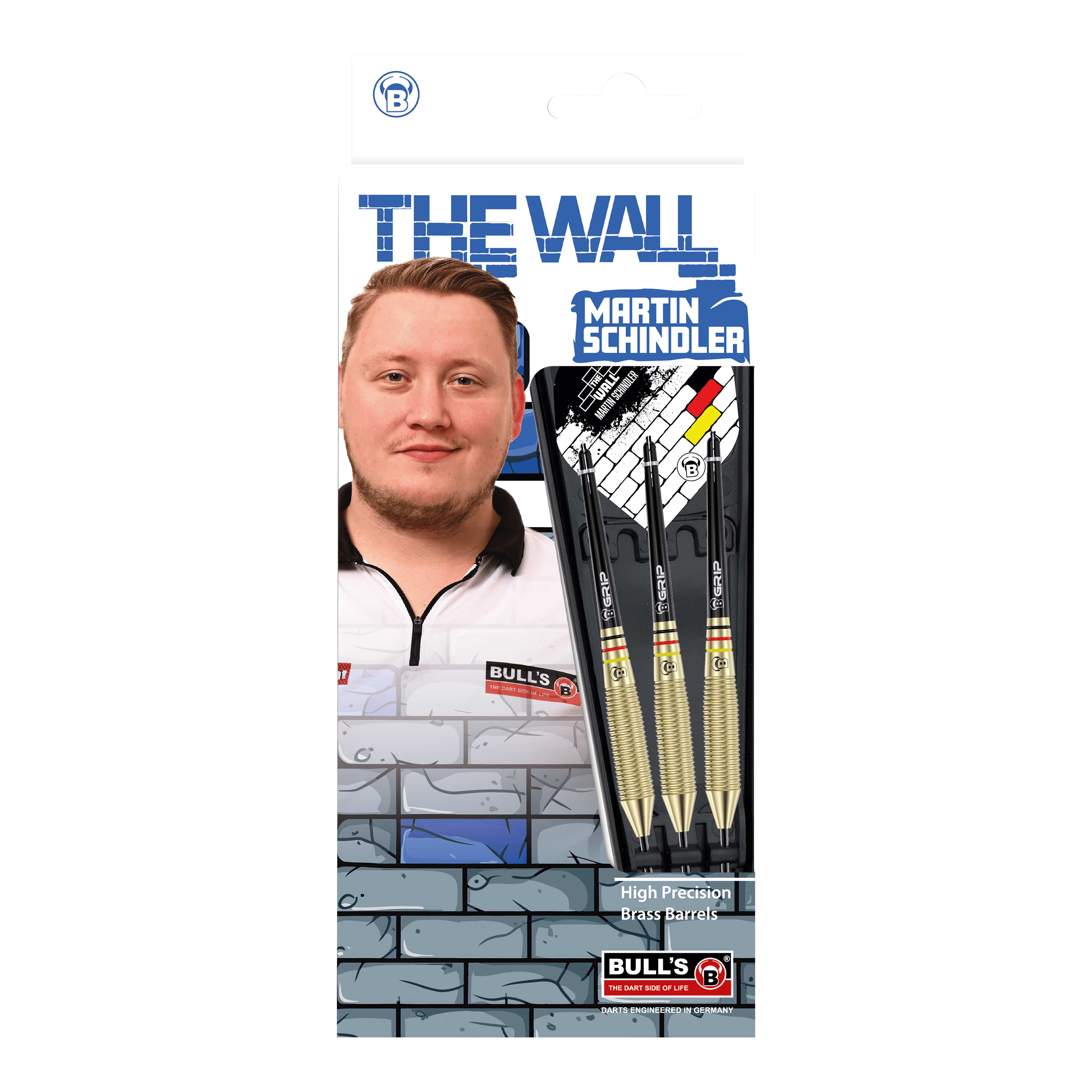 Taureaux Martin Schindler Le Mur Laiton Steeldarts Auf dem Bild ist die Verpackung der "Bulls Martin Schindler The Wall Brass Steeldarts" zu sehen. Sie zeigt ein Foto von Martin Schindler sowie drei Steeldarts mit Messing-Barrels.