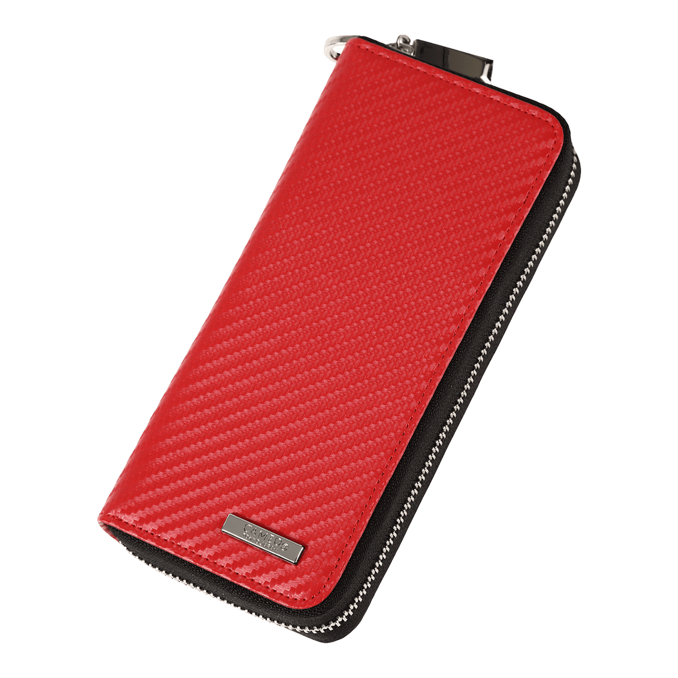 Mallette d'affaires Cameo Pro3 Das Bild zeigt ein rotes Etui mit einer strukturierten Oberfläche und einem Reißverschluss. An der unteren Ecke befindet sich ein kleines Metallschild mit einer Gravur.