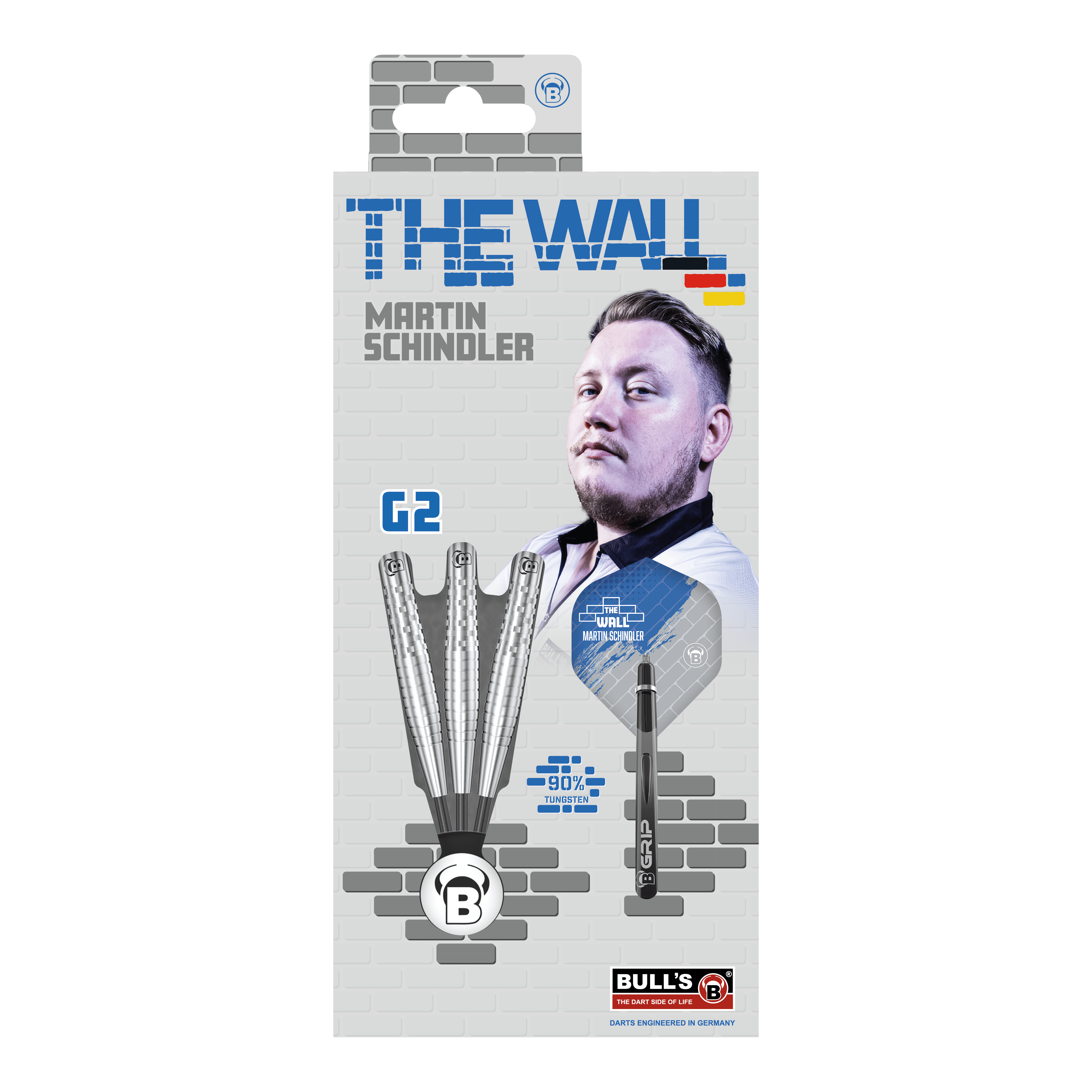 Fléchettes en acier Bulls Martin Schindler Original Generation 2 Die Verpackung zeigt die "Bulls Martin Schindler Original Generation 2 Steeldarts" mit dem Bild von Martin Schindler. Auf der Vorderseite sind drei Darts und die Aufschrift "THE WALL" sowie "90% Tungsten" abgebildet.