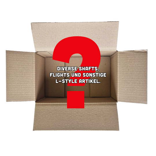 Boîte mystère McDart - Style L Das Bild zeigt einen offenen Karton mit einem großen roten Fragezeichen darin. In der Mitte steht der Text: "Diverse Shafts, Flights und sonstige L-Style Artikel."