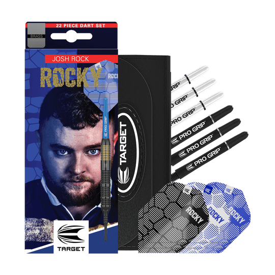 Fléchettes souples en laiton Target Josh Rock - 18 g Das Bild zeigt das Produkt "Target Josh Rock Brass Softdarts - 18g" mit Zubehör wie Flights und Shafts. Auf der Verpackung ist ein Porträt sowie der Name des Spielers Josh Rock zu sehen.