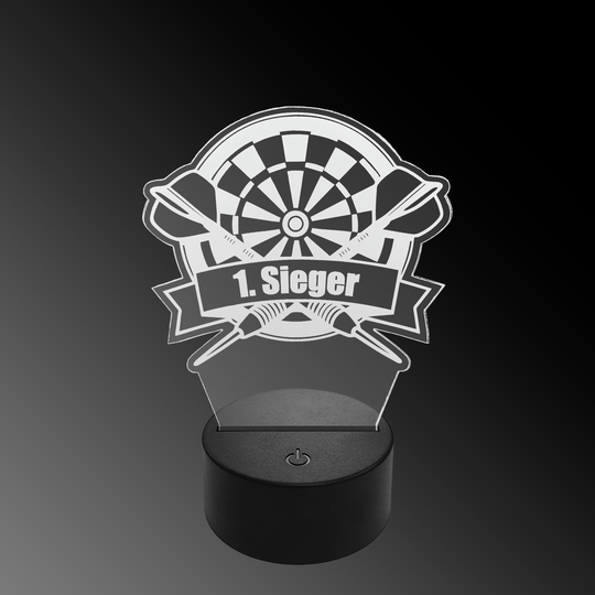 Lampe à fléchettes LED en plexiglas avec texte personnalisé Das Bild zeigt eine LED-Lampe mit einem Plexiglasaufsatz in Form eines Dartboards und zwei gekreuzten Darts. Auf dem Schild steht "1. Sieger" geschrieben.