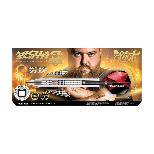 Shot Michael Smith atteint des fléchettes en acier Auf dem Bild ist eine Verpackung für Steeldarts mit dem Namen „Michael Smith - World Champion“ zu sehen. In der Mitte ist ein Mann mit Bart abgebildet, und ein großer silberner Dartpfeil ist prominent dargestellt.